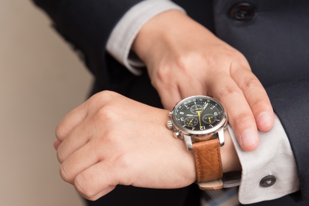 businessman-checking-time_1357-97